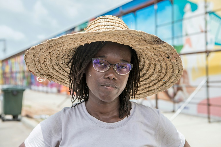 Beninese artist Drusille Fagnibo during the Graff Effect festival on May 18, 2022 in Cotonou, Benin (AFP - YANICK FOLLY)