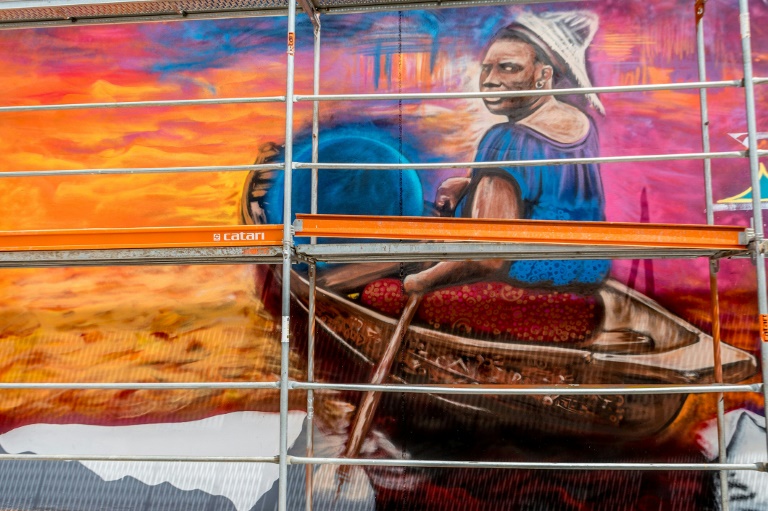 A mural by Beninese artist Romario Agbo-Koffi, known as Dr Mario, during the Graff Effect festival, on May 18, 2022 in Cotonou, Benin (AFP - YANICK FOLLY)